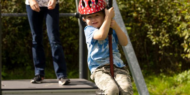 Child playing on the zip line at Foremark